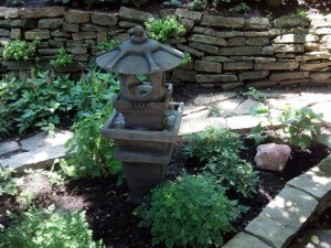 We certainly have literal water in the form of our fountain.  Its beautiful trickling sound fills up our garden space. 